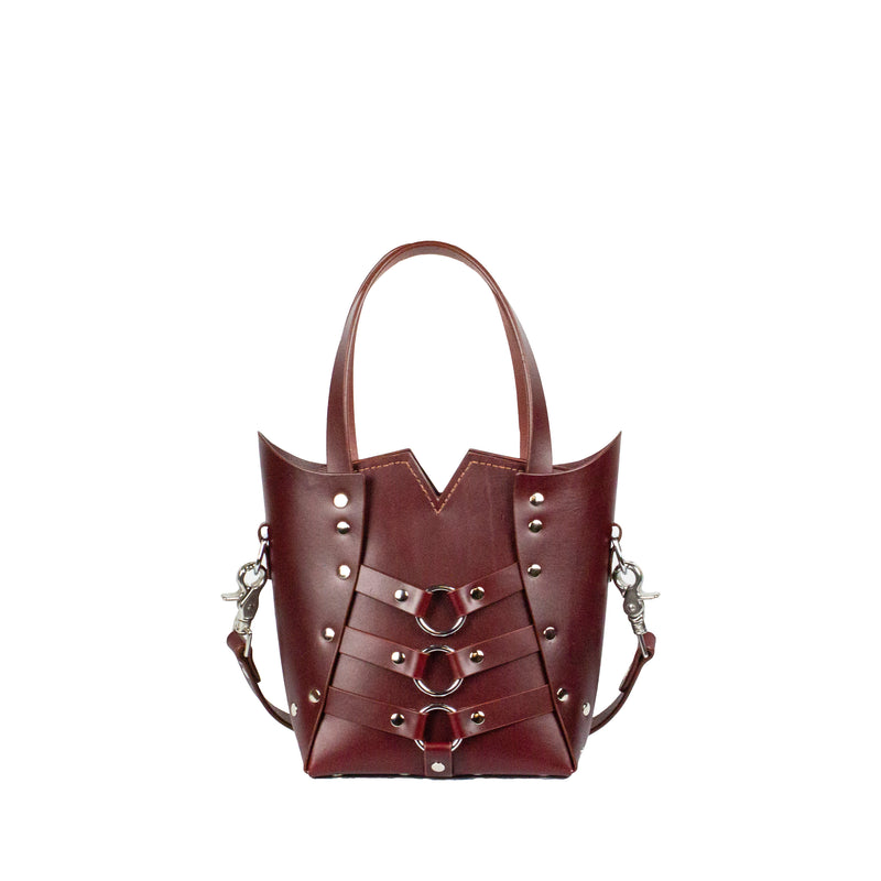 oxblood leather handbag with silver hardware and cross body strap
